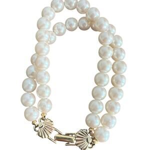 Vintage double strand (faux?) pearl bracelet w gold tone shell fold over clasp